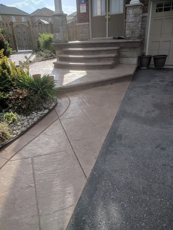 Stamped concrete walkway and steps at a front entrance