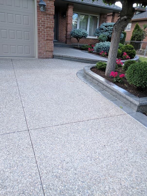 Exposed aggregate driveway with curved stamped border