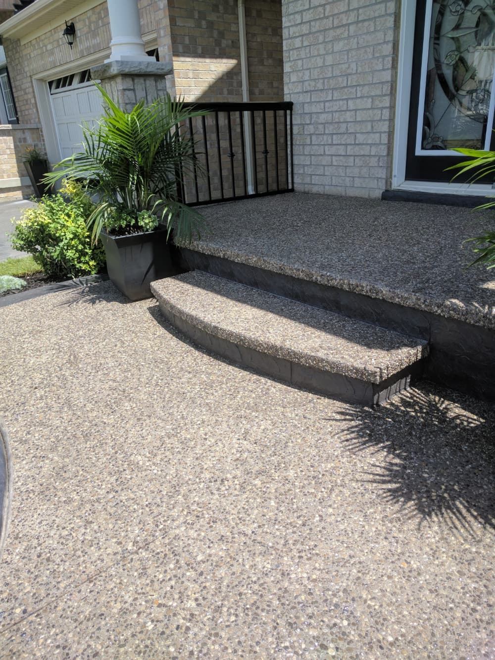 Exposed aggregate porch steps at a front entrance