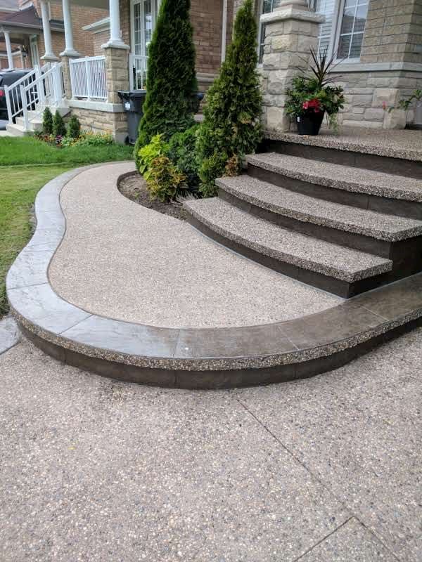 Curved exposed aggregate steps with garden border