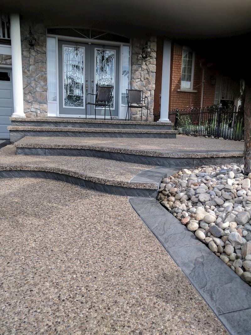 Exposed aggregate entrance steps with stamped borders