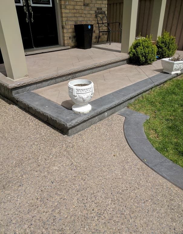 Exposed aggregate entrance with charcoal stamped border