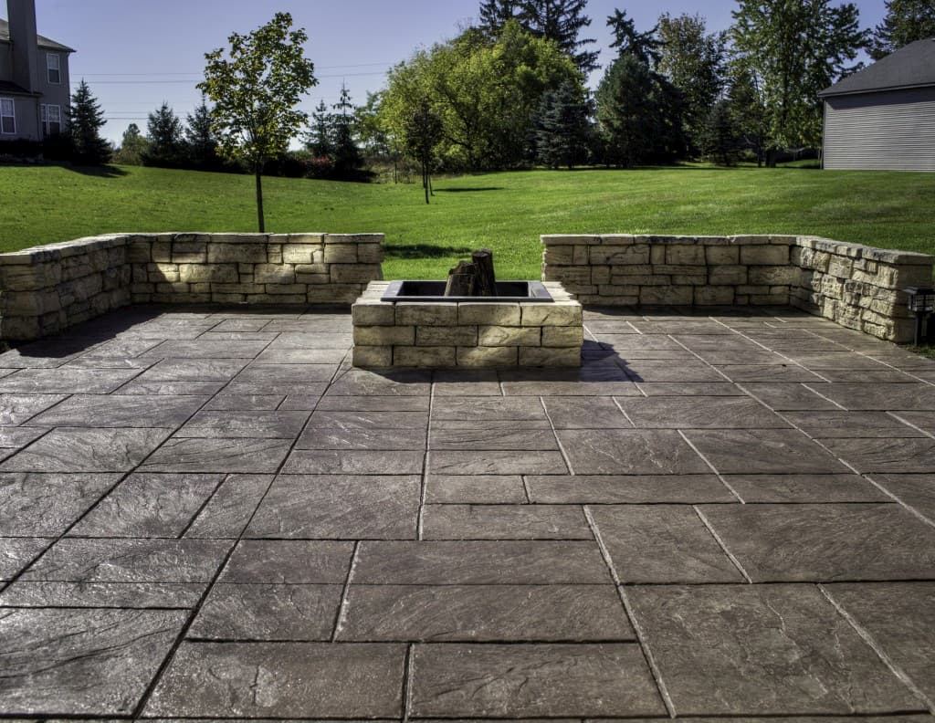 Stamped concrete patio with stone fire pit