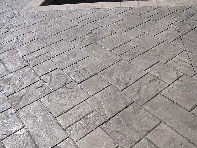 Stamped concrete pavers in herringbone pattern