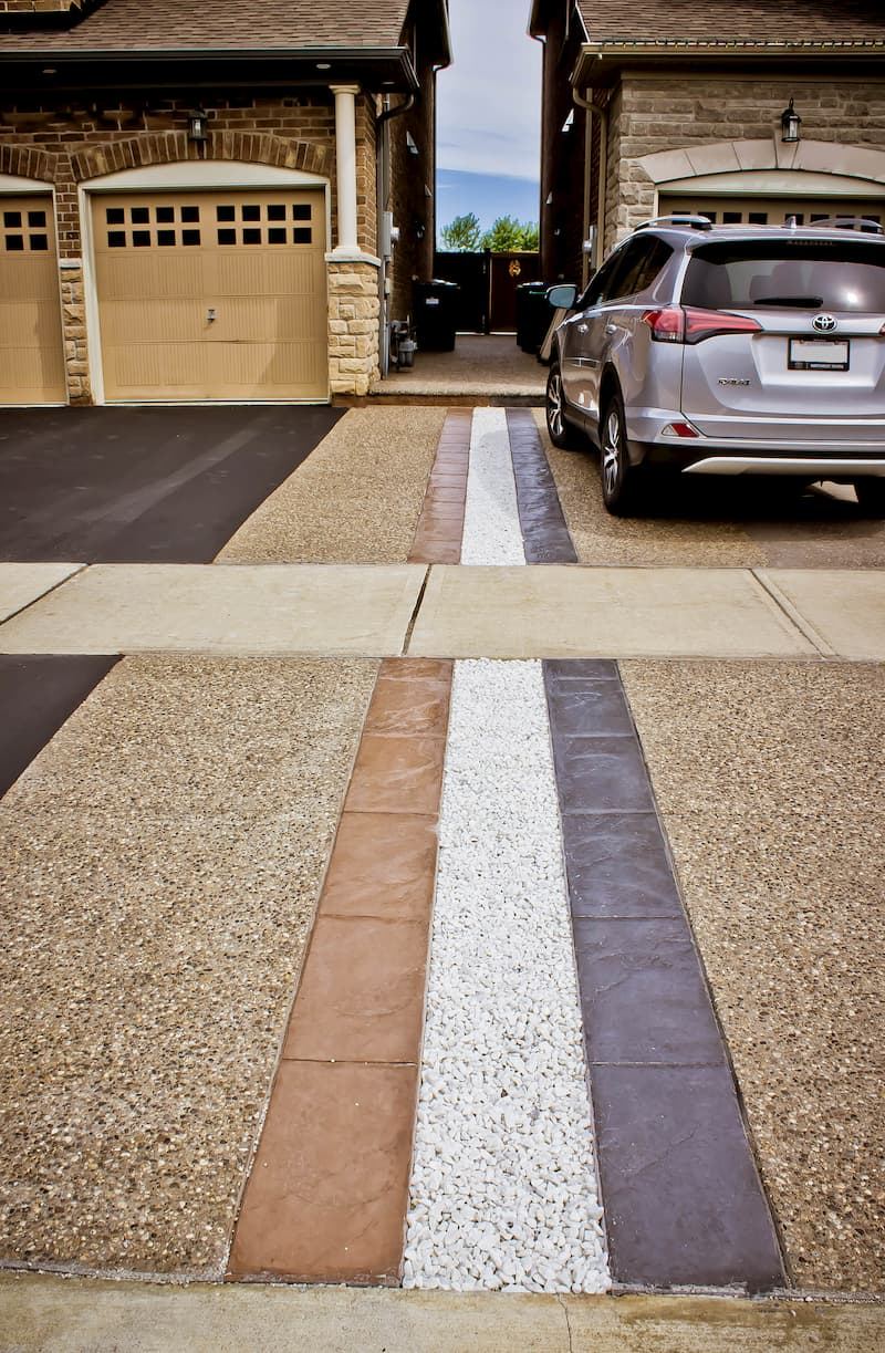 Exposed aggregate driveway with multi-tone stamped border