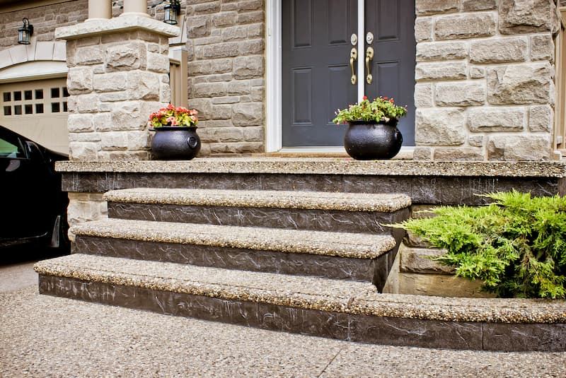 Exposed aggregate front steps with planters