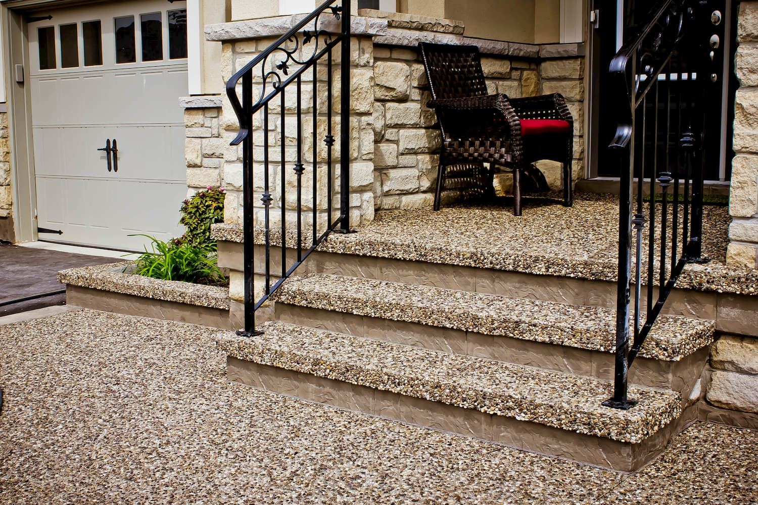 Exposed aggregate steps with wrought iron railing