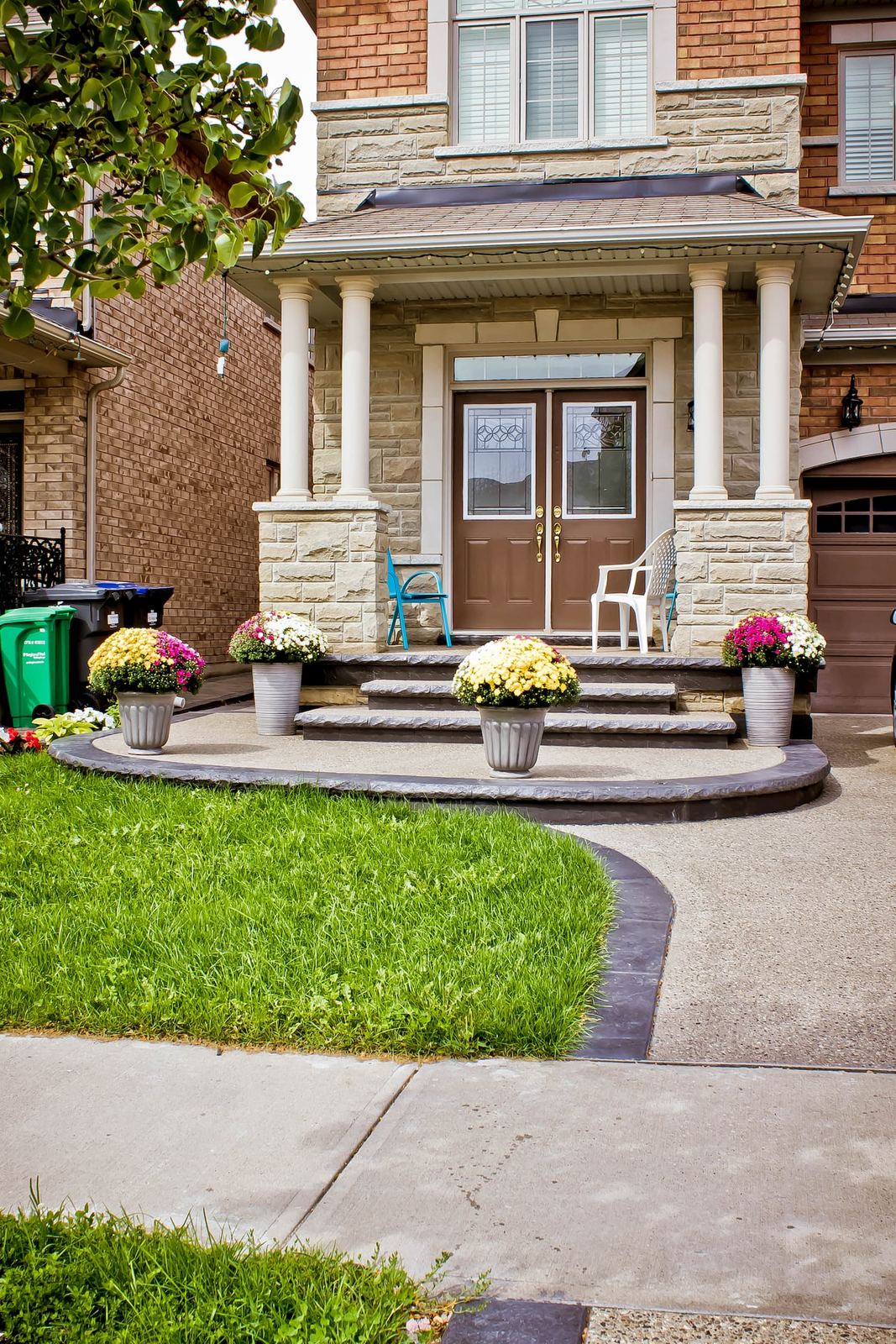 Exposed aggregate walkway with garden and porch