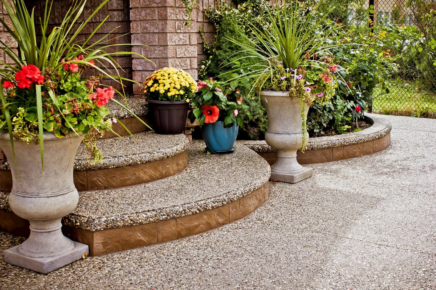 Curved exposed aggregate steps with planters