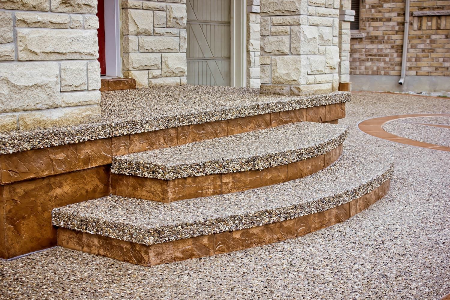 Curved exposed aggregate steps with stamped risers